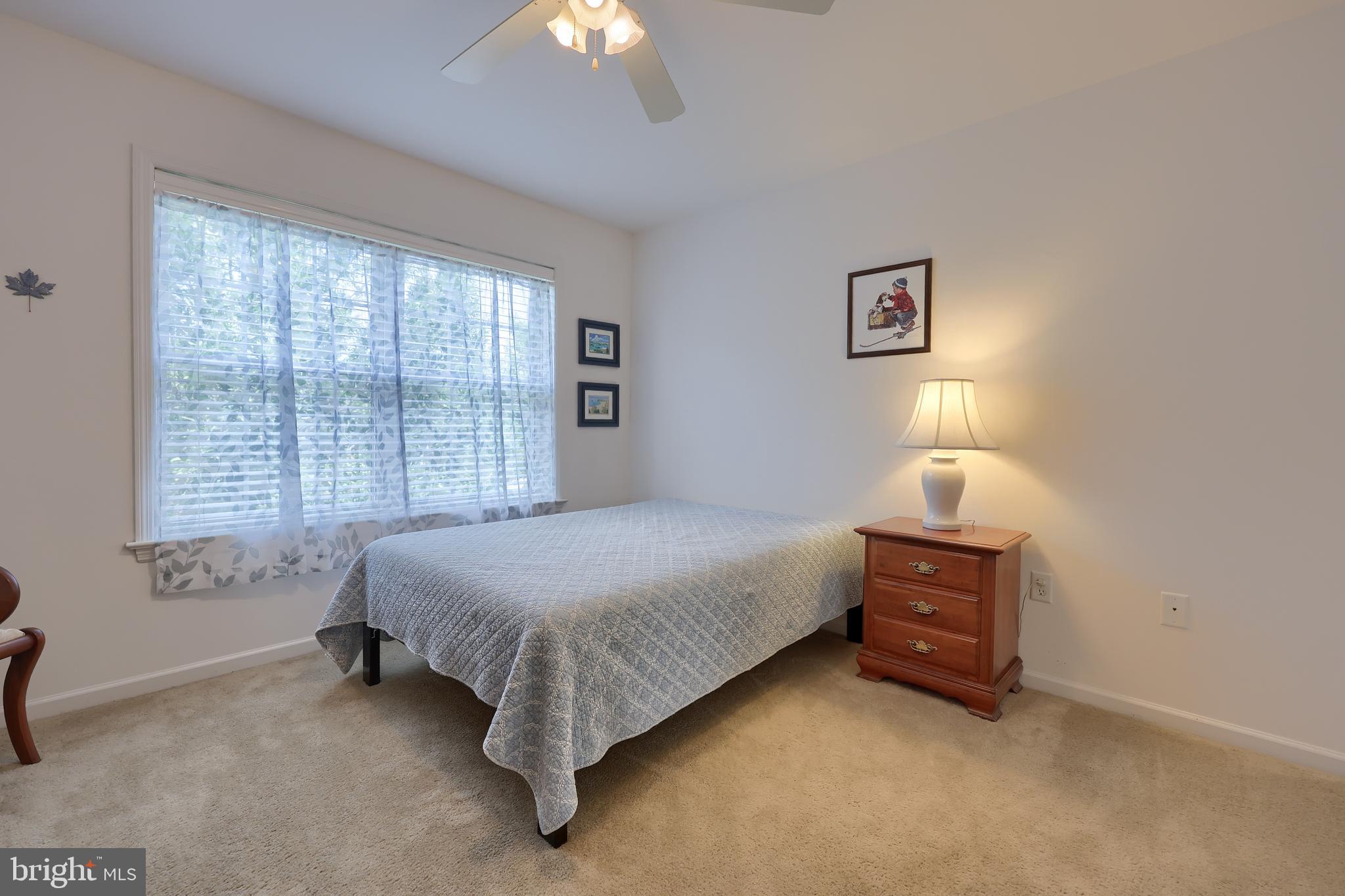 520 Providence Court Lititz, PA 17543 - Photo 20 of 44 a bed room with a bed and a lamp