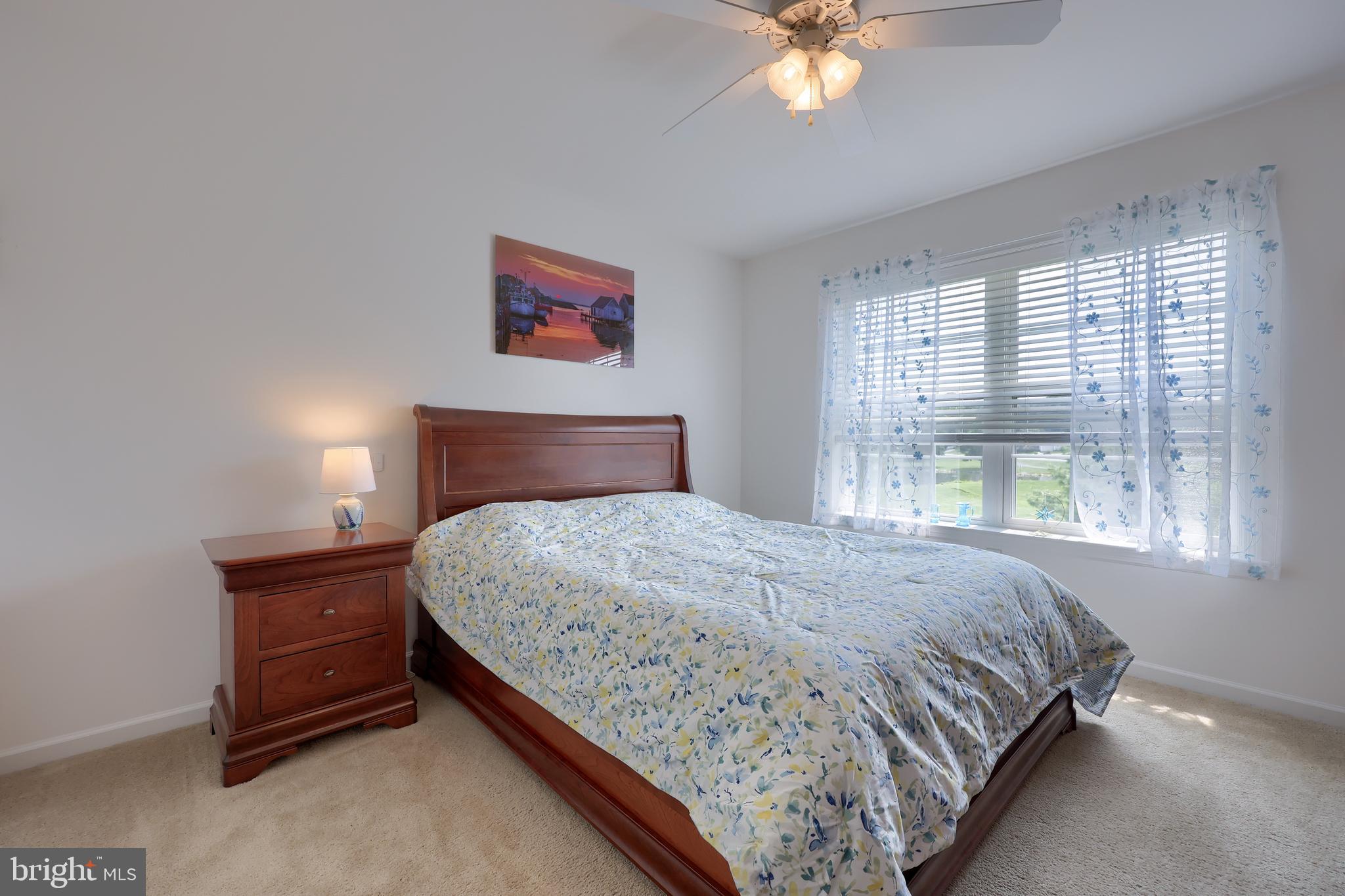 520 Providence Court Lititz, PA 17543 - Photo 23 of 44 a bedroom with a bed and a chandelier