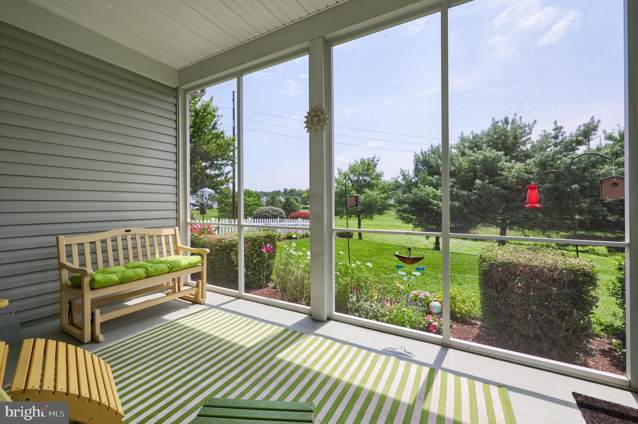 520 Providence Court Lititz, PA 17543 - Photo 29 of 44 a view of a deck with a floor to ceiling window next to a yard