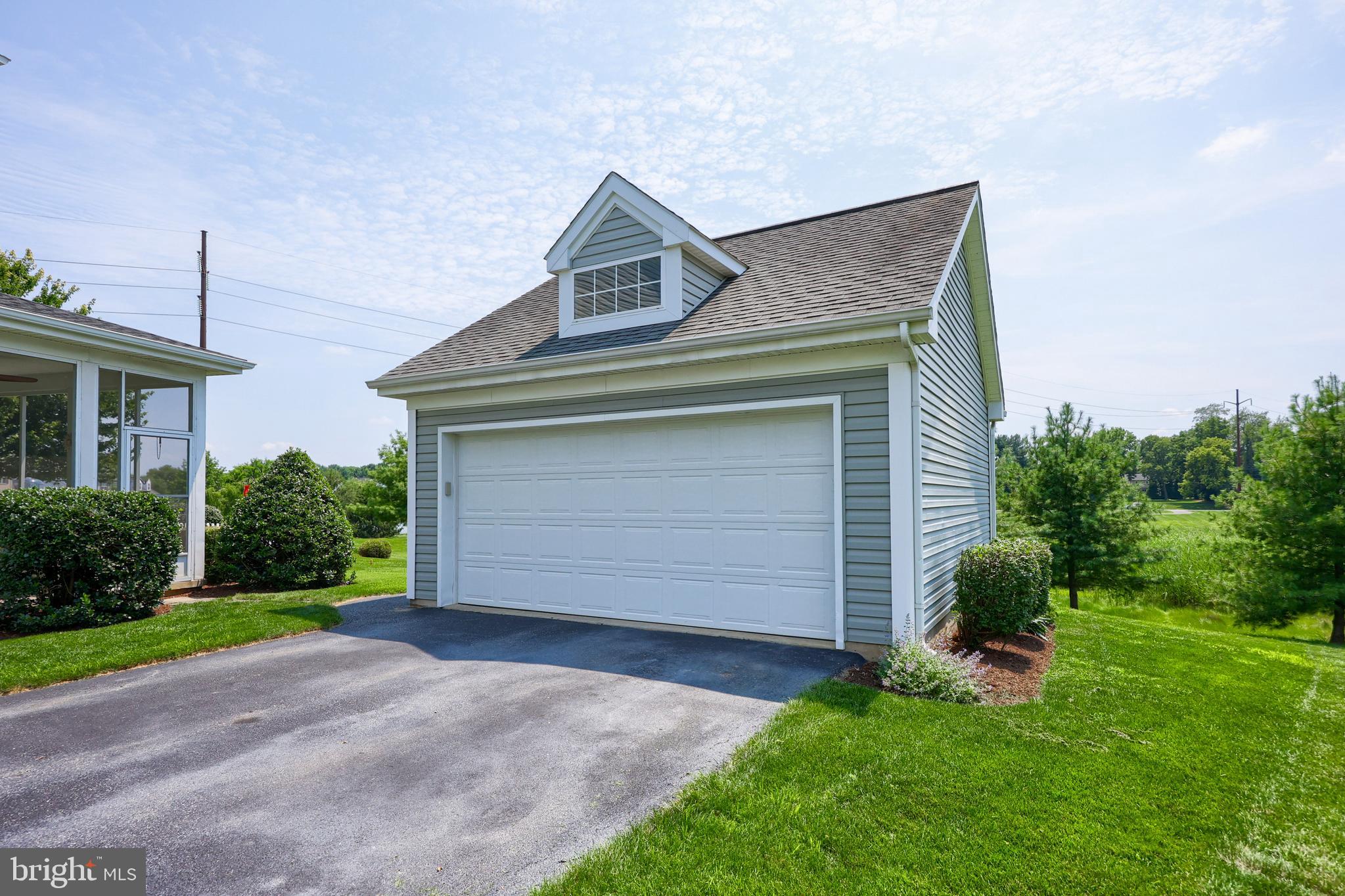 520 Providence Court Lititz, PA 17543 - Photo 37 of 44 a front view of a house with a garden and garage