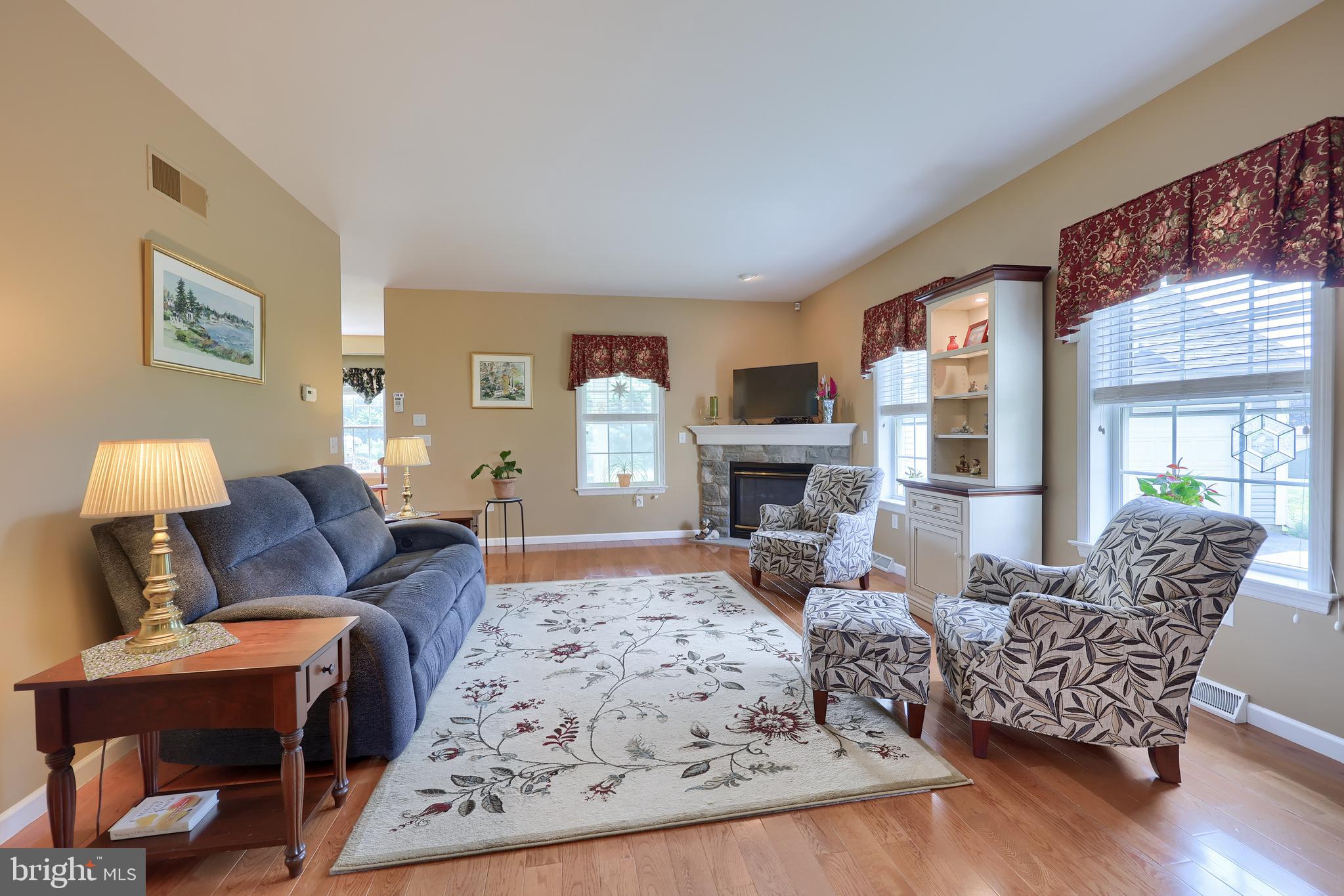 520 Providence Court Lititz, PA 17543 - Photo 4 of 44 a living room with furniture fireplace and a table