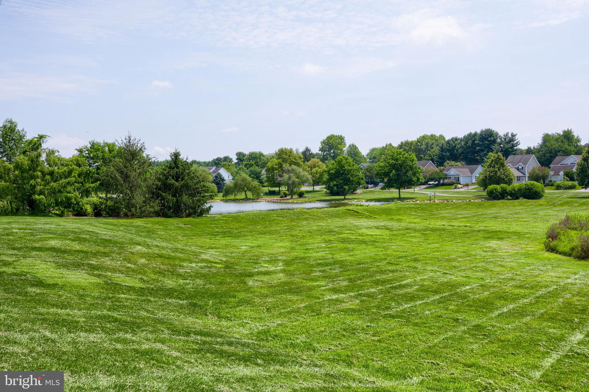 520 Providence Court Lititz, PA 17543 - Photo 43 of 44 a backyard of a house with lots of green space and fog