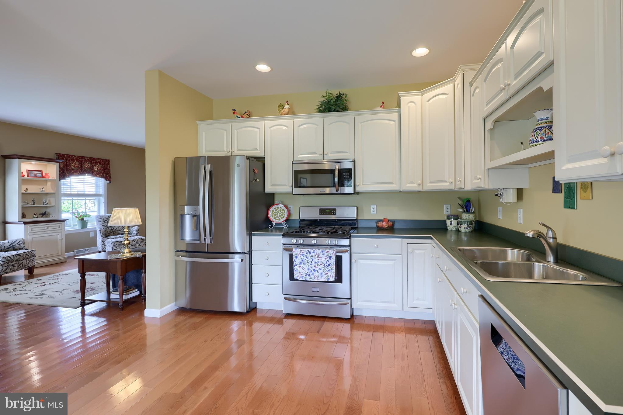 520 Providence Court Lititz, PA 17543 - Photo 10 of 44 a kitchen with granite countertop a refrigerator and a sink