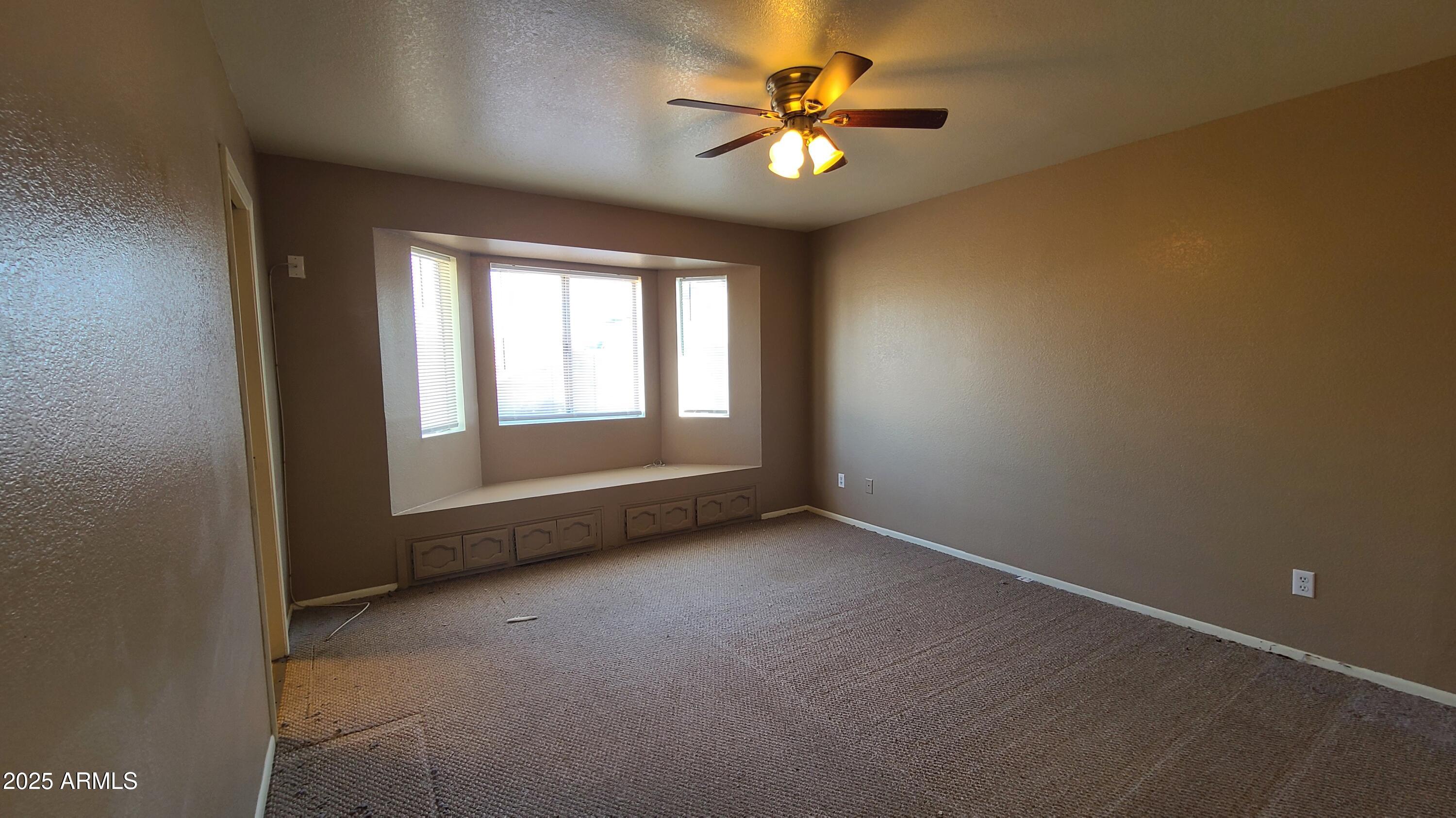 3105 South Rogers Mesa, AZ 85202 - Photo 11 of 17 an empty room with a window