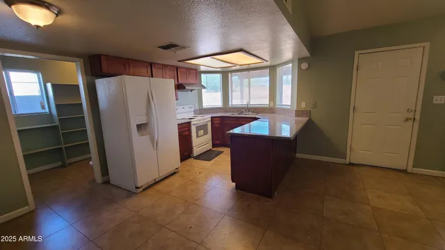 a view of a room with furniture and front door