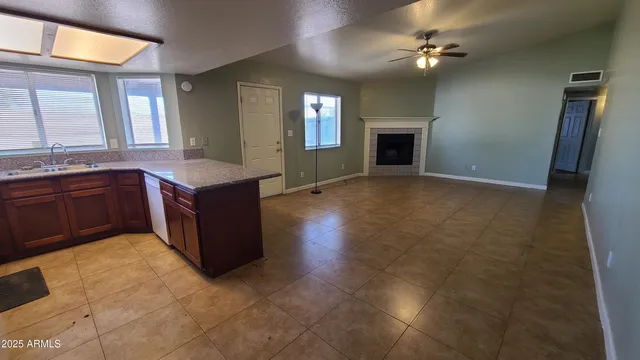 a view of a kitchen cabinets and a fireplace