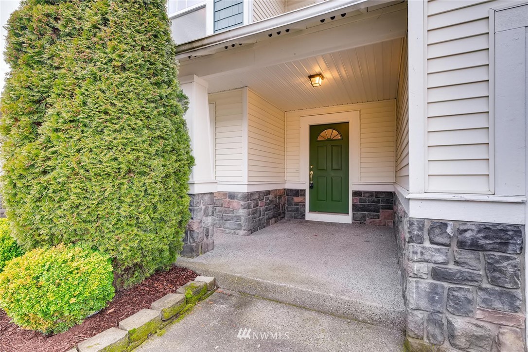 309 Index Place Southeast Renton, WA 98056 - Photo 3 of 28 a front view of a house with a yard
