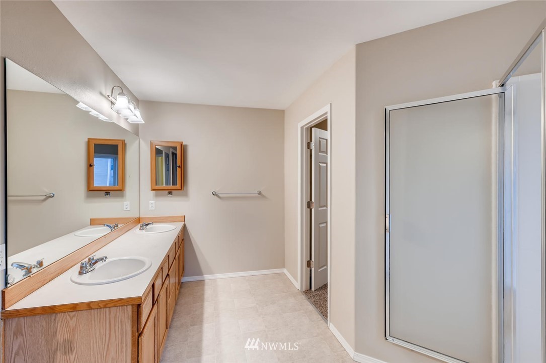 309 Index Place Southeast Renton, WA 98056 - Photo 21 of 28 a view of a bathroom with a sink and a mirror
