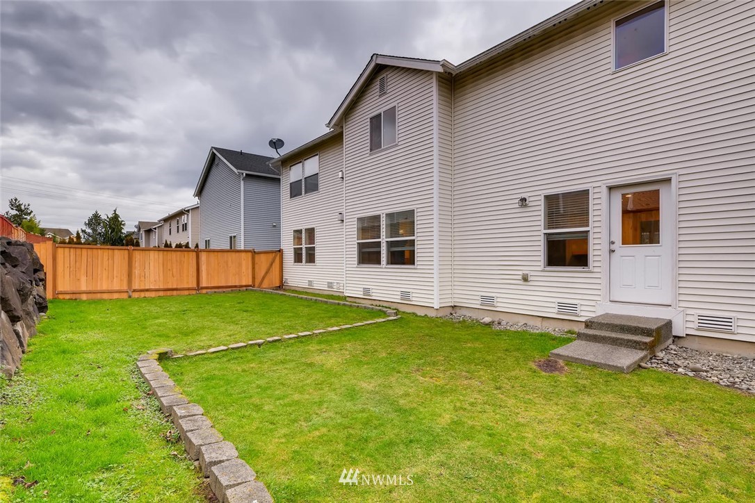 309 Index Place Southeast Renton, WA 98056 - Photo 28 of 28 a front view of a house with a yard and trees