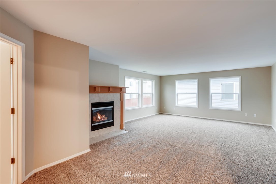 309 Index Place Southeast Renton, WA 98056 - Photo 5 of 28 a view of a livingroom with a fireplace and window