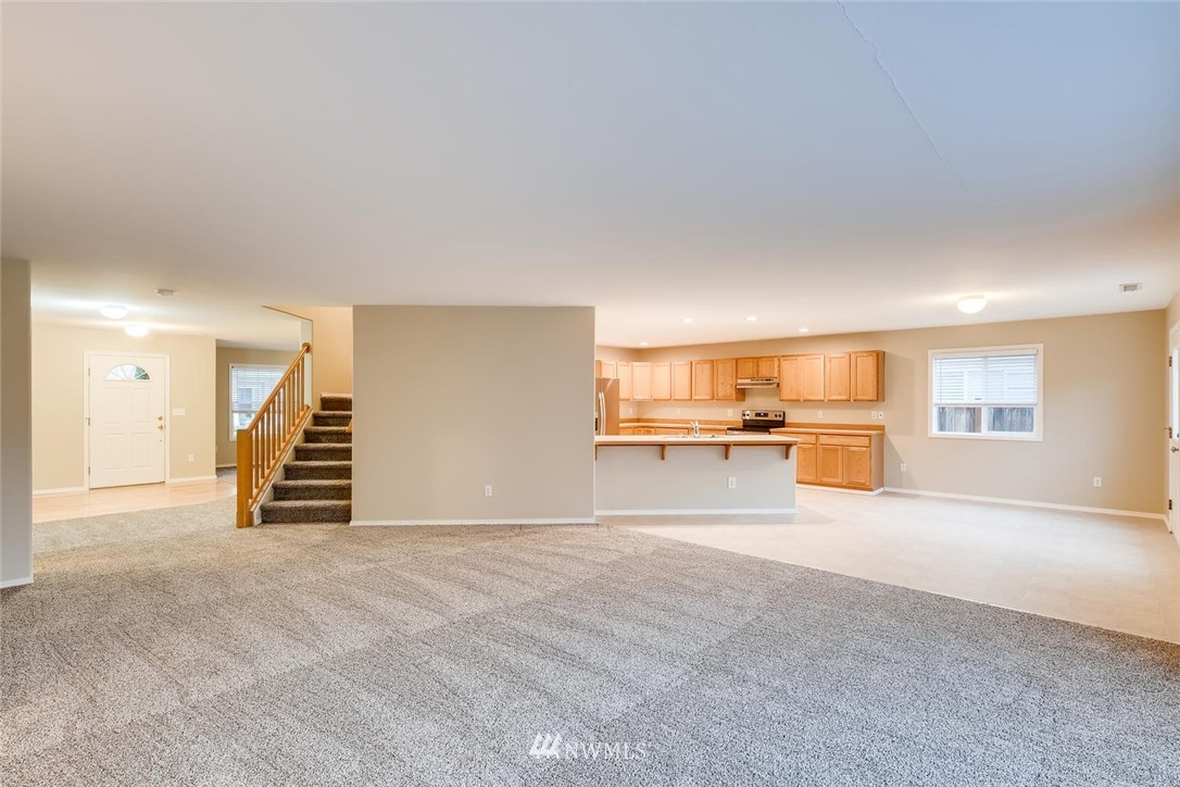 309 Index Place Southeast Renton, WA 98056 - Photo 7 of 28 a view of a livingroom with a furniture and a kitchen