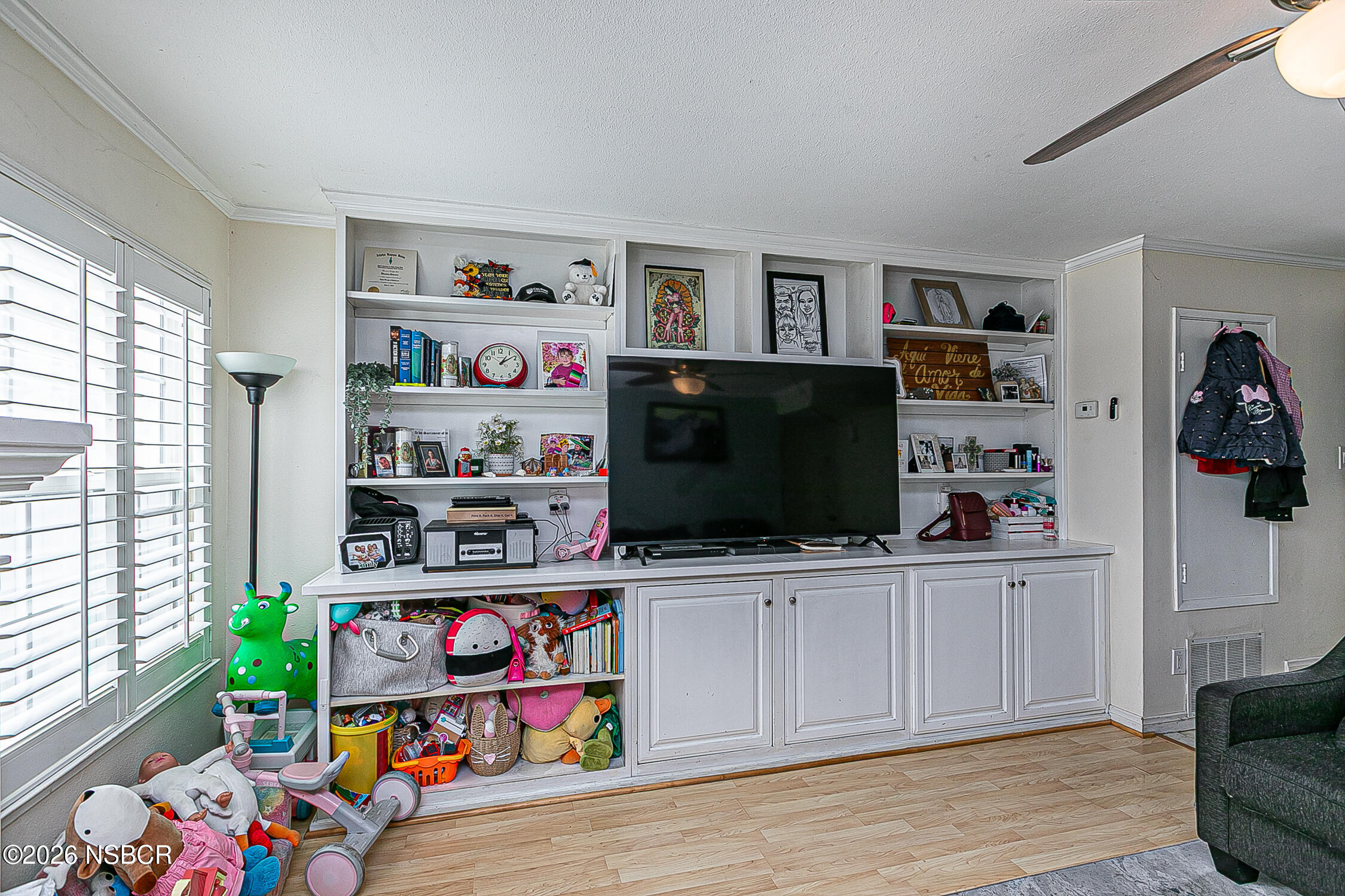 712 Pebble Beach Place Santa Maria, CA 93454 - Photo 7 of 31 a room with furniture and a flat screen tv