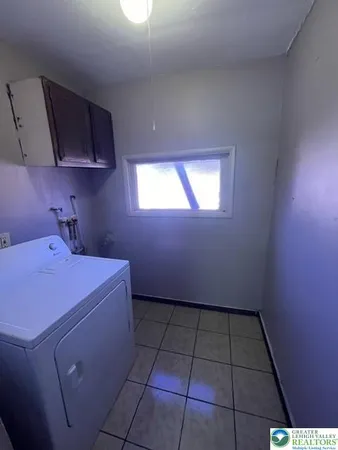 a storage & utility room with a window