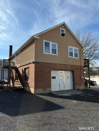 a front view of a house with garage