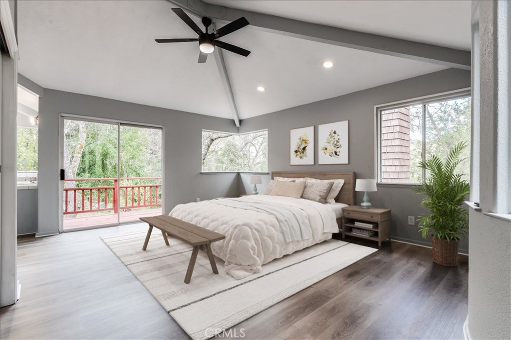 6281 York Mountain Road Templeton, CA 93465 - Photo 16 of 31 a bedroom with a large bed and a chandelier