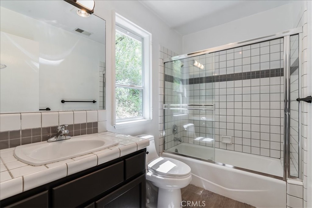6281 York Mountain Road Templeton, CA 93465 - Photo 19 of 31 a bathroom with a sink a toilet and shower