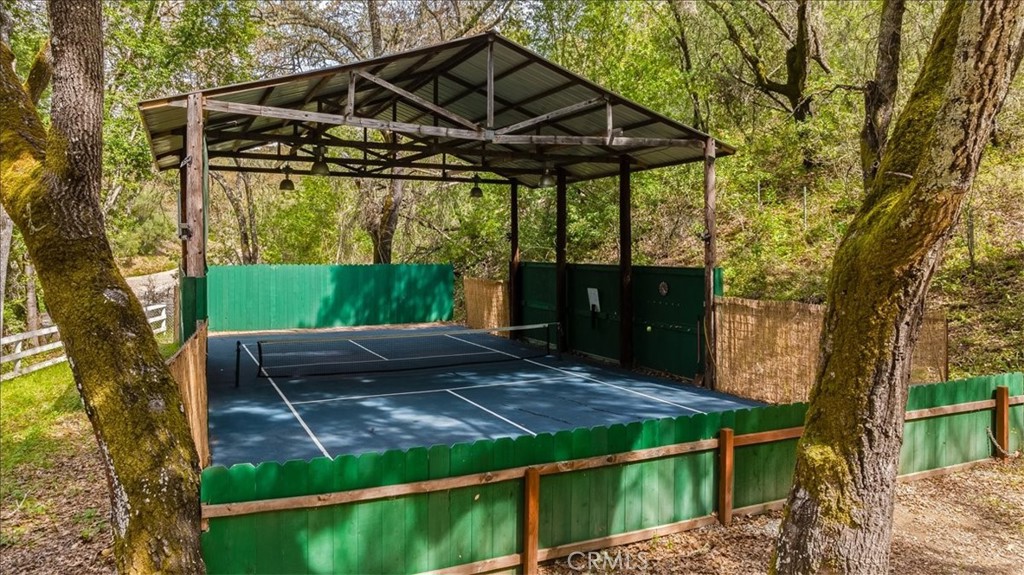 6281 York Mountain Road Templeton, CA 93465 - Photo 30 of 31 a view of a backyard with wooden fence and a large tree