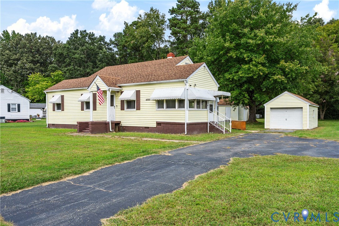 4000 Wayside Road Charles City, VA 23030 - Photo 26 of 30 Yellow siding exterior with white window awnings a