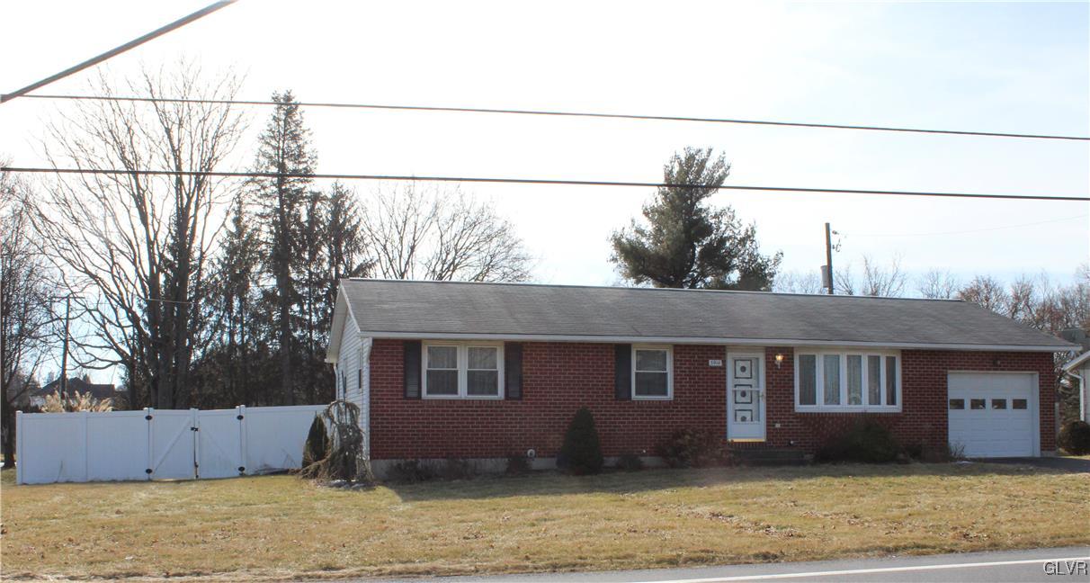 3918 Mechanicsville Road Whitehall, PA 18052 - Photo 2 of 25 a front view of a house with a yard