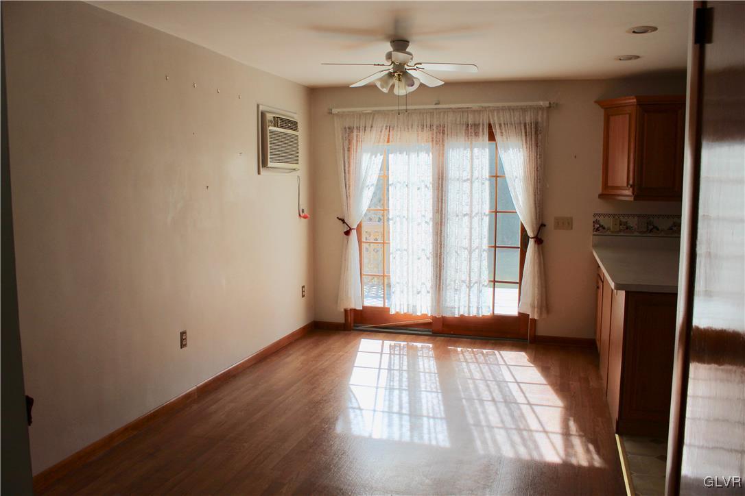 3918 Mechanicsville Road Whitehall, PA 18052 - Photo 5 of 25 a view of empty room with wooden floor and fan