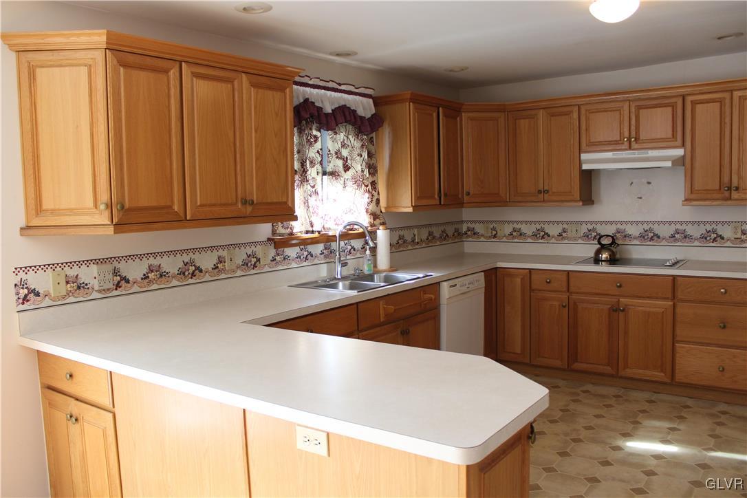3918 Mechanicsville Road Whitehall, PA 18052 - Photo 7 of 25 a kitchen with a sink cabinets and window