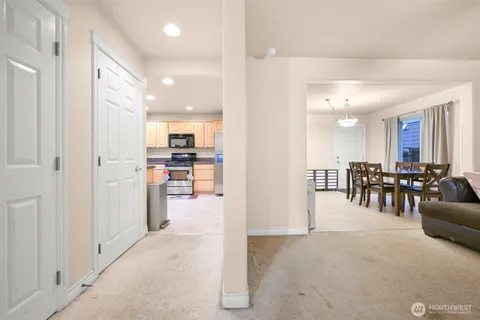 a view of a living room kitchen and dining room