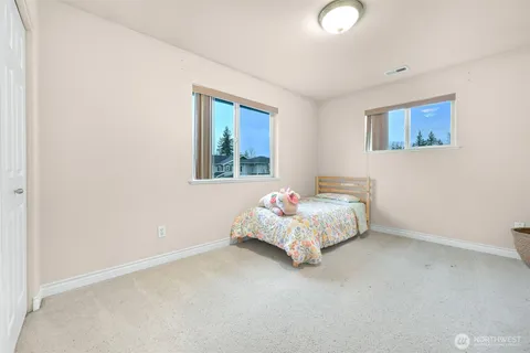 a bedroom with a bed and window