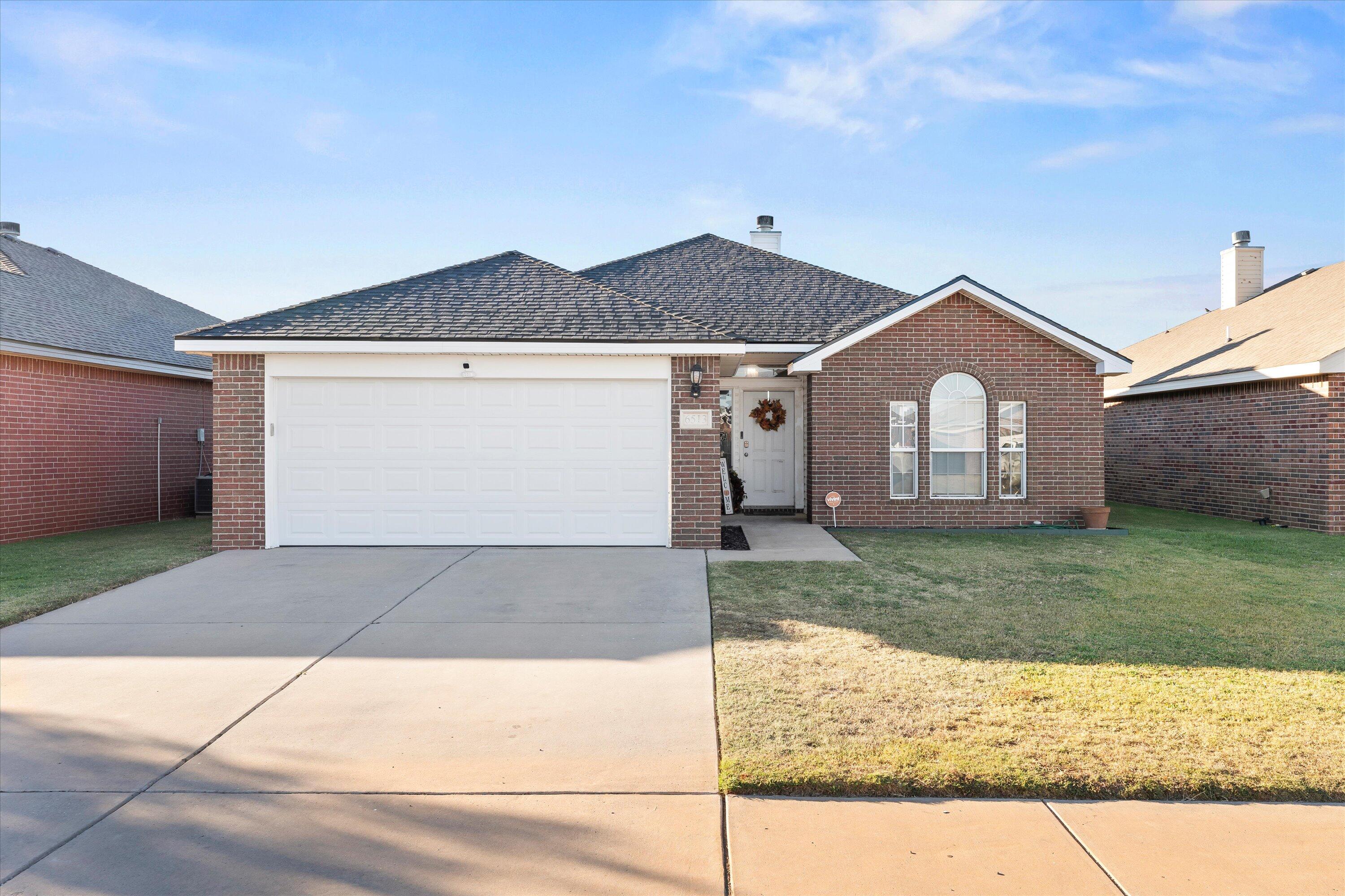6513 85th Street Lubbock, TX 79424 - Photo 1 of 22 a view of a house with a yard