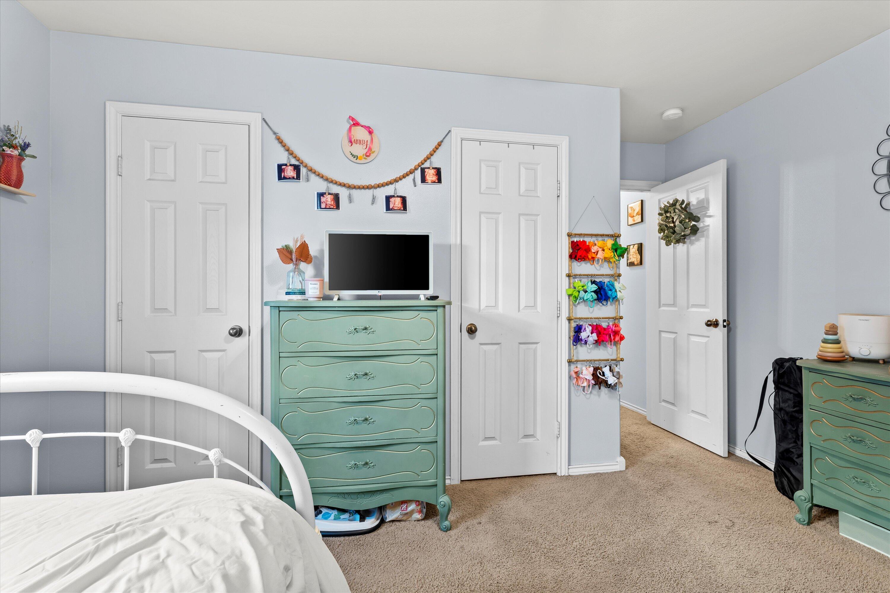 6513 85th Street Lubbock, TX 79424 - Photo 20 of 22 a bedroom with a bed and a window