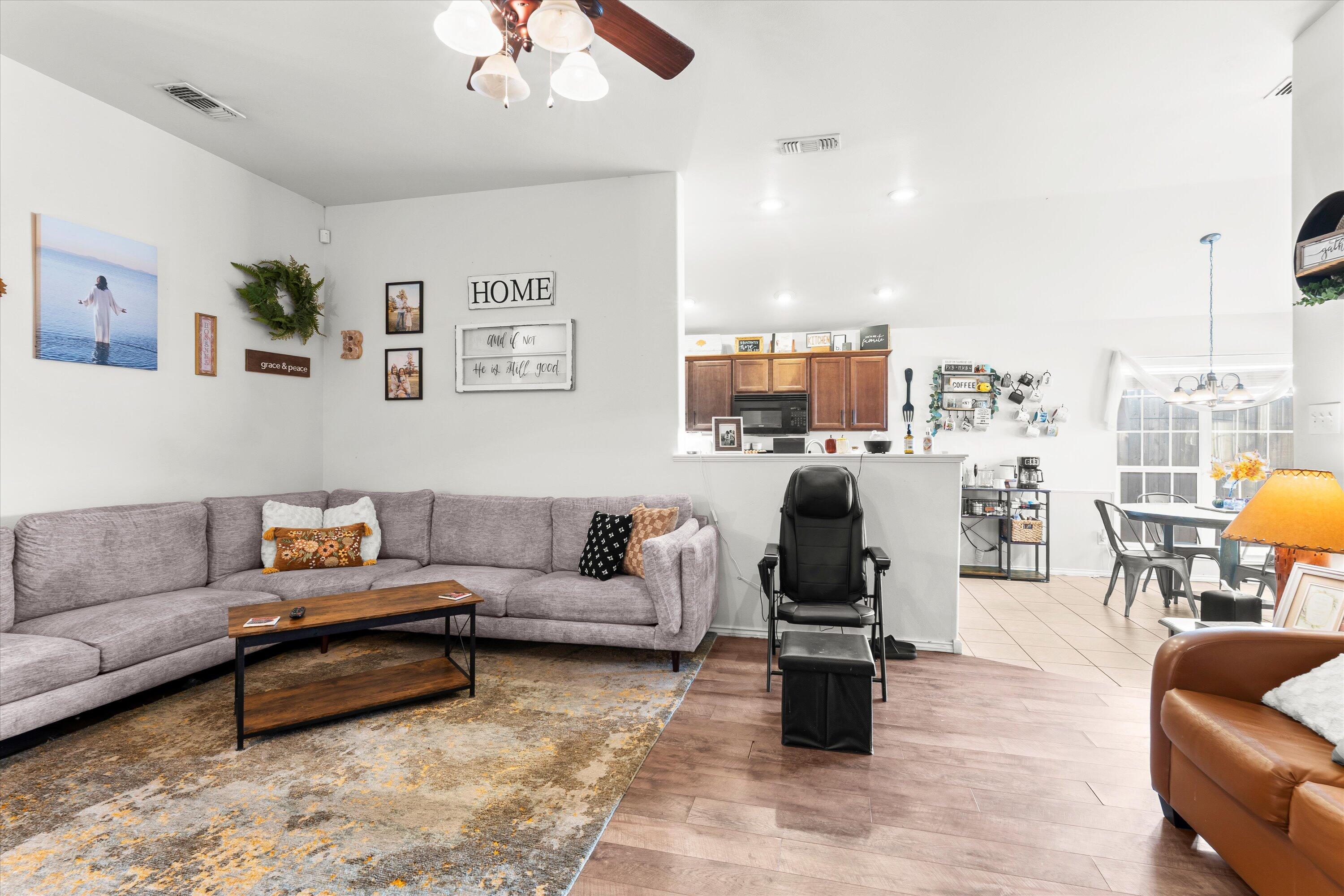 6513 85th Street Lubbock, TX 79424 - Photo 7 of 22 a living room with furniture and white walls