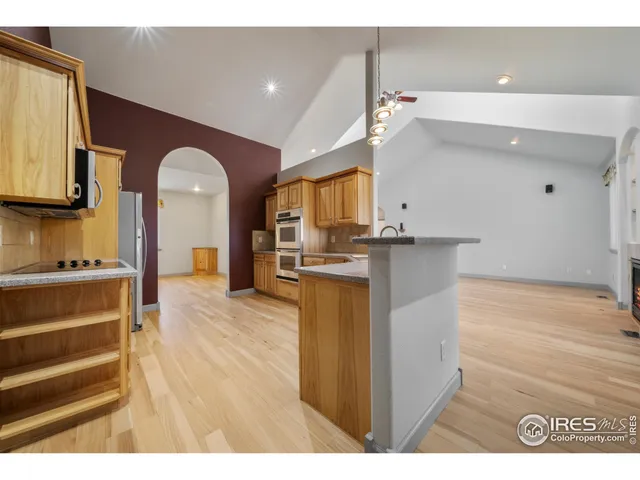 a view of kitchen with cabinets and wooden floor