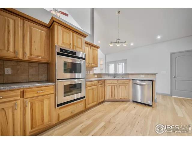 a kitchen with stainless steel appliances a stove top oven and sink