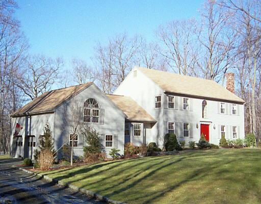 6 Tall Oaks Road Wilton, CT 06897 - Photo 1 of 1 a view of a white house next to a yard with a tree
