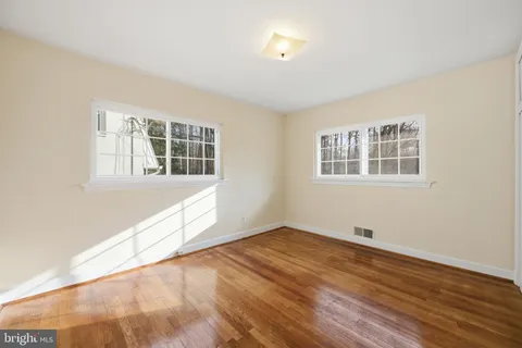 a view of empty room with windows