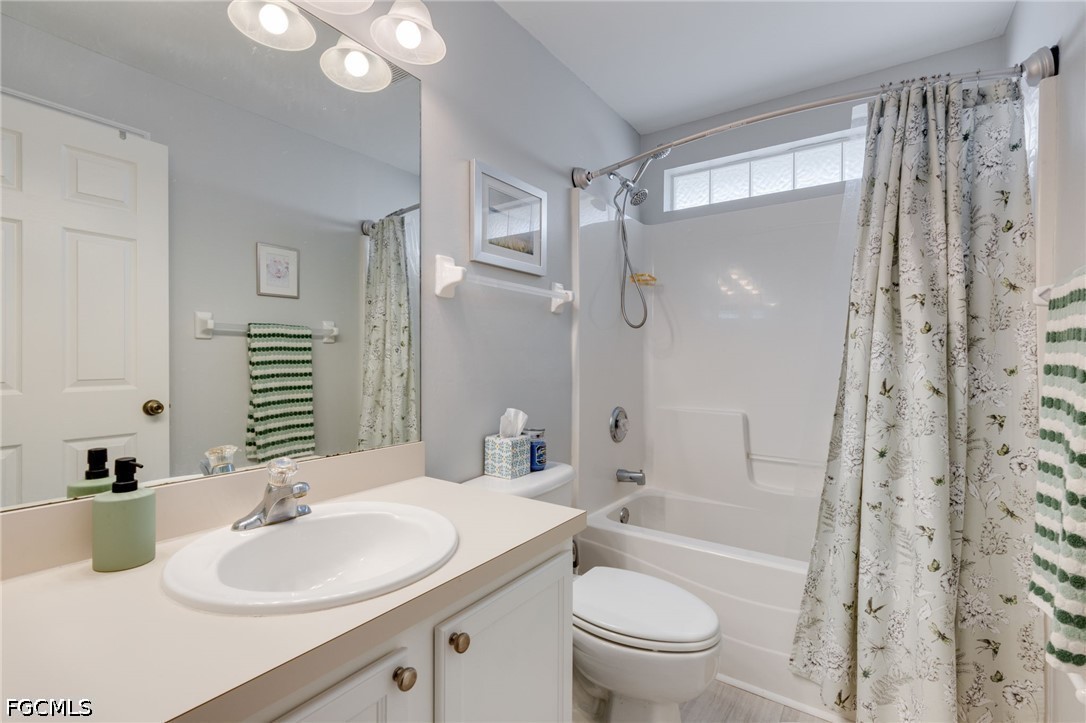 3801 28th Street Southwest Lehigh Acres, FL 33976 - Photo 15 of 37 a bathroom with a sink a toilet and shower