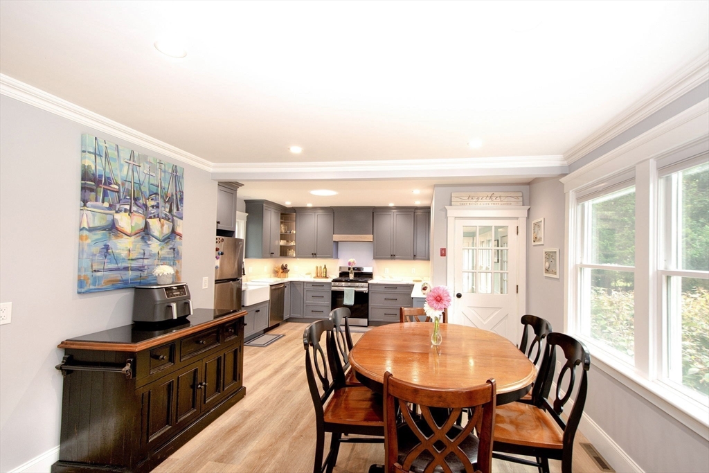 231 Main Street Kingston, MA 02364 - Photo 14 of 25 a view of a dining room with furniture and a window