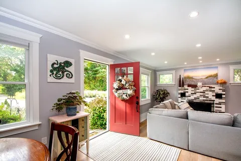 a living room with furniture and a large window