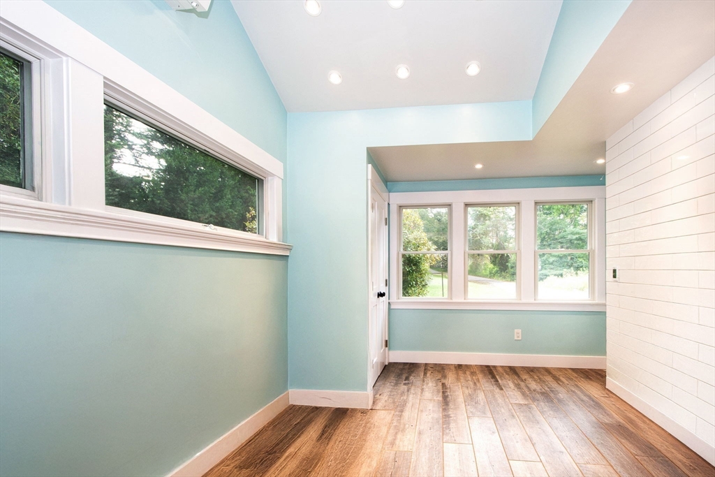 231 Main Street Kingston, MA 02364 - Photo 21 of 25 an empty room with wooden floor and windows