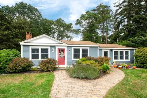 a front view of a house with a yard