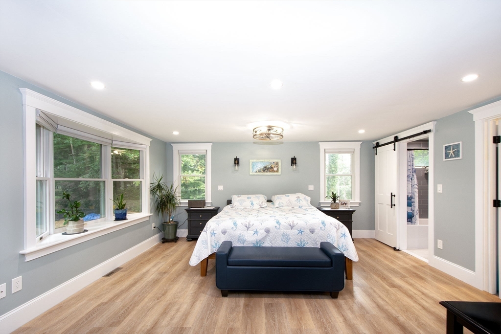 231 Main Street Kingston, MA 02364 - Photo 9 of 25 a bedroom with a large bed and a large window