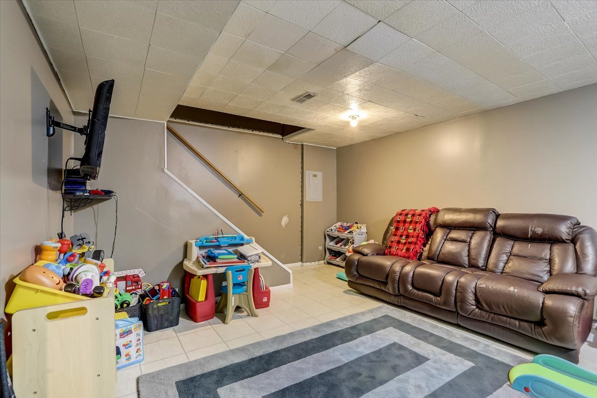 323 Village Creek Drive Lake In The Hills, IL 60156 - Photo 17 of 28 a living room with furniture and a couch
