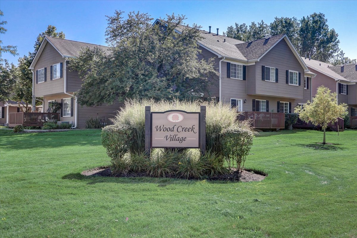 323 Village Creek Drive Lake In The Hills, IL 60156 - Photo 25 of 28 a front view of a house with garden