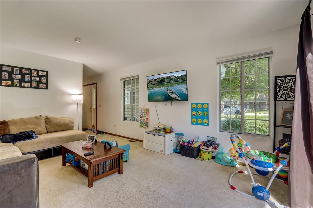 323 Village Creek Drive Lake In The Hills, IL 60156 - Photo 5 of 28 a living room with furniture and a window