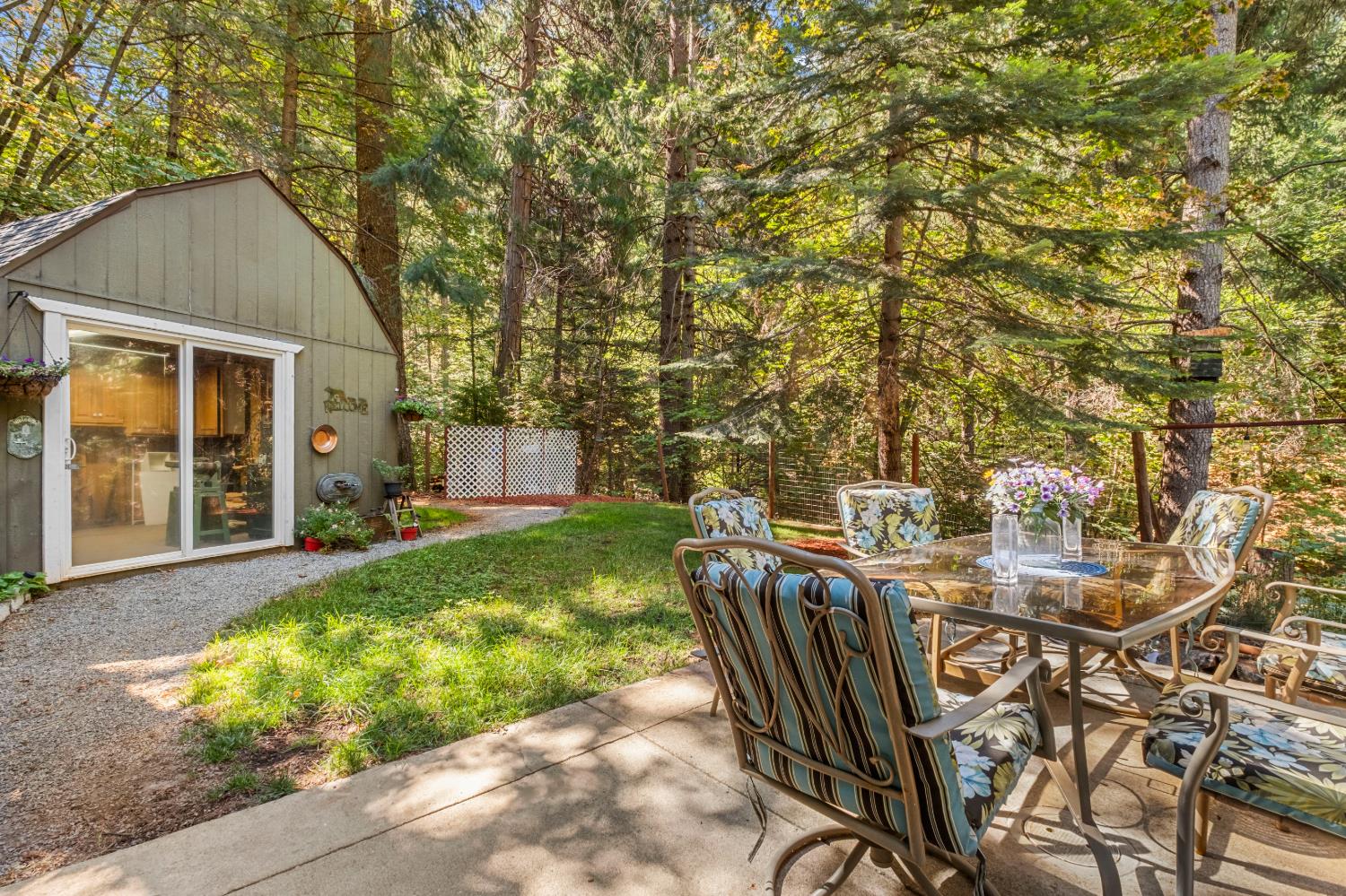 2296 Forebay Road Pollock Pines, CA 95726 - Photo 41 of 62 Backyard patio and 12X12 storage shed/shop