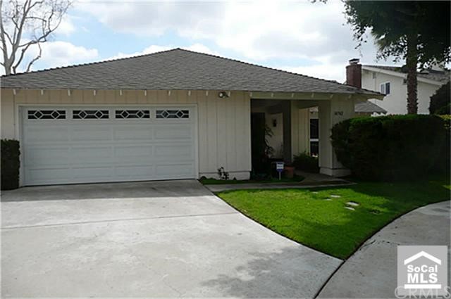 Charming Tustin Meadows home with new garage door and extra long driveway.