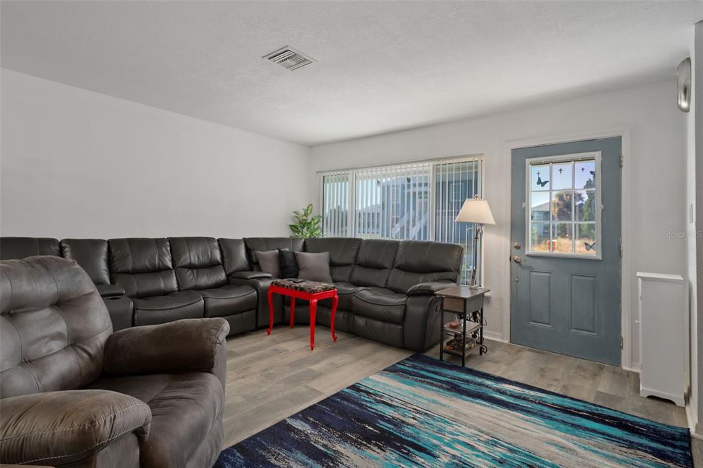 3320 Gardenia Drive Hernando Beach, FL 34607 - Photo 11 of 59 a living room with furniture and a rug
