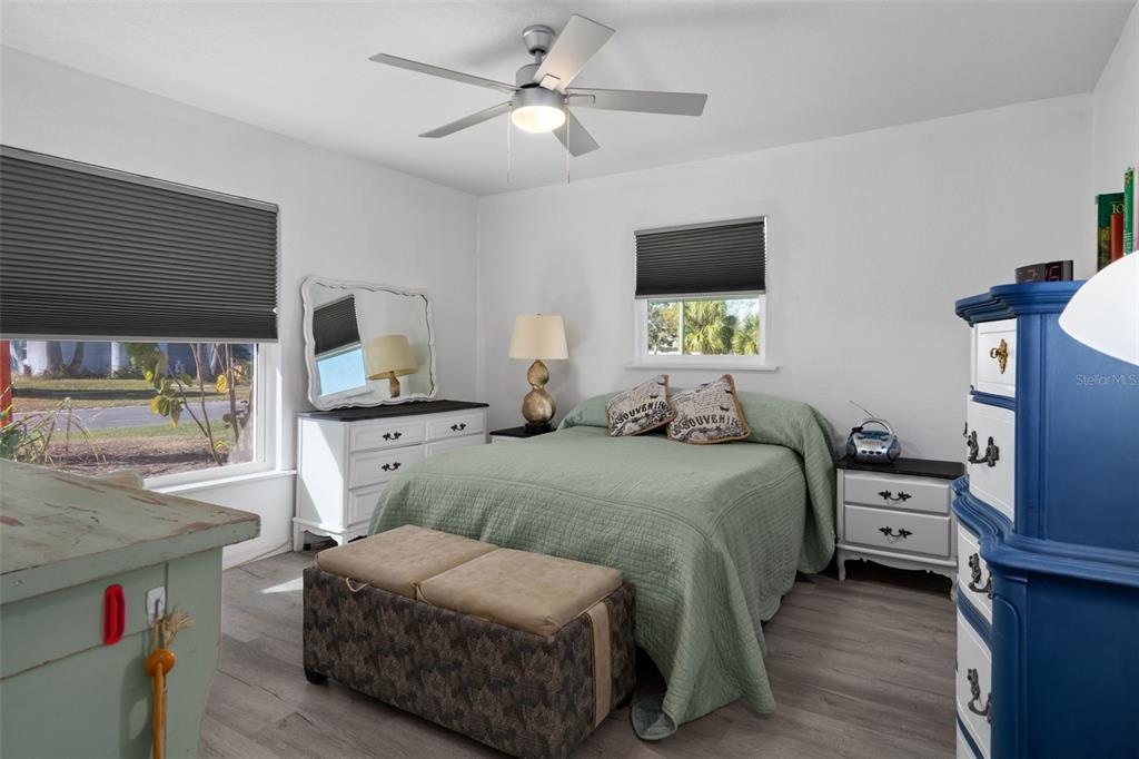 3320 Gardenia Drive Hernando Beach, FL 34607 - Photo 13 of 59 a bedroom with a bed and a flat screen tv