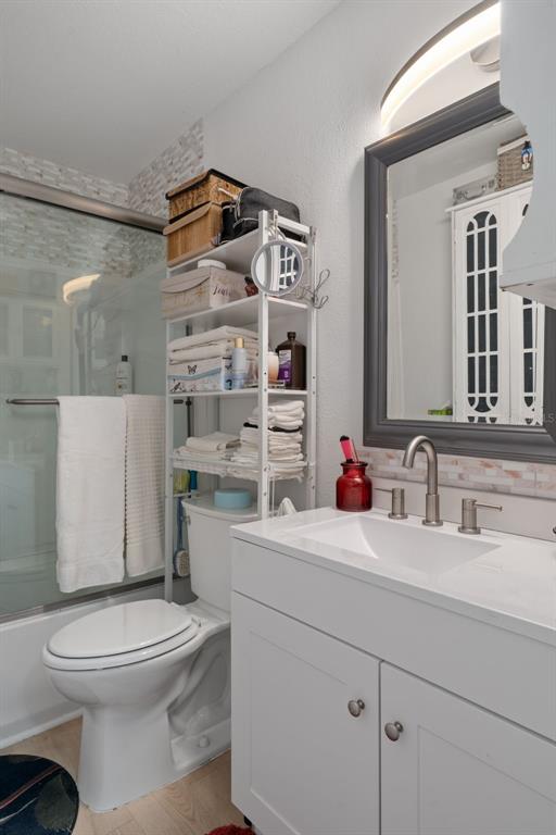 3320 Gardenia Drive Hernando Beach, FL 34607 - Photo 15 of 59 a bathroom with a sink a toilet and shower