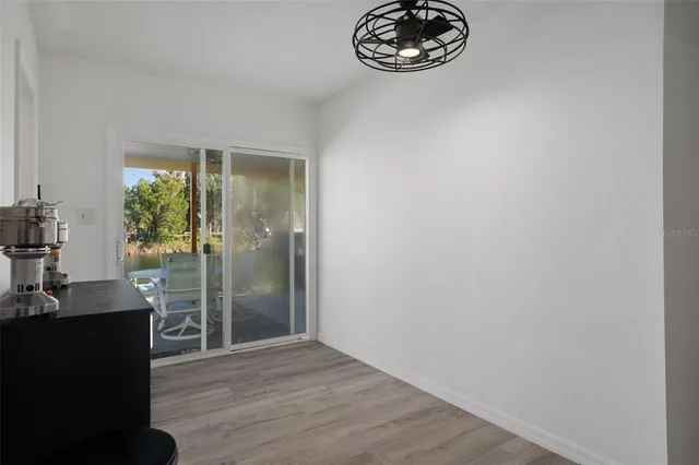 a outdoor living space with furniture a rug and a flat screen tv