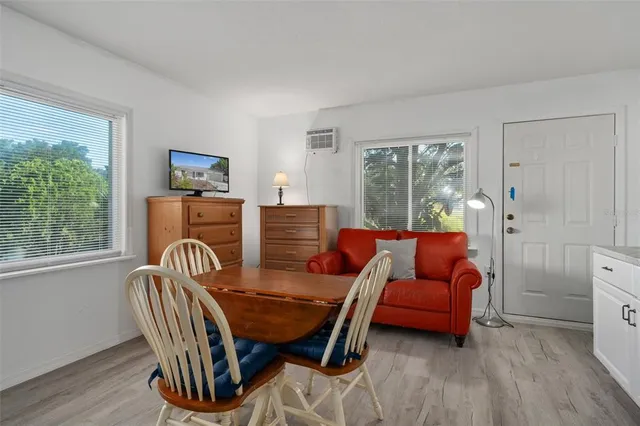 a bedroom with furniture and a window